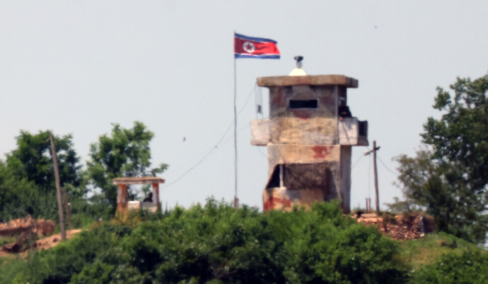 The flag of North Korea flies at a guard post near the border with the South’s Paju on June 4, 2024, the day that South Korea officially suspended a 2018 confidence-building military pact with North Korea. (Yonhap) 