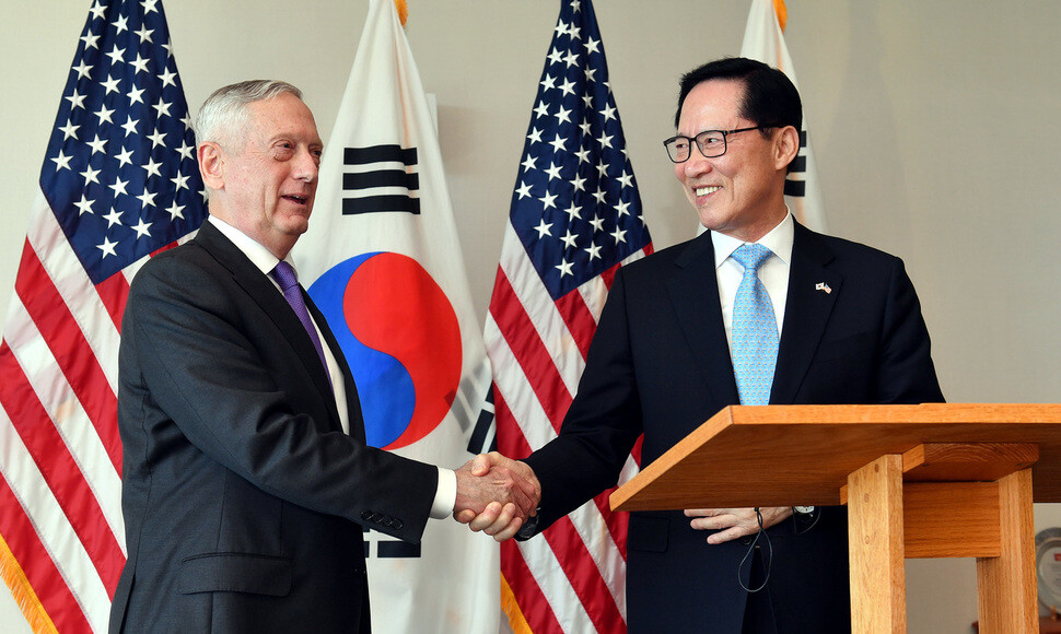 South Korean Defense Minister shakes hands with US Defense Secretary James Mattis during their summit at the US Pacific Command in Honolulu