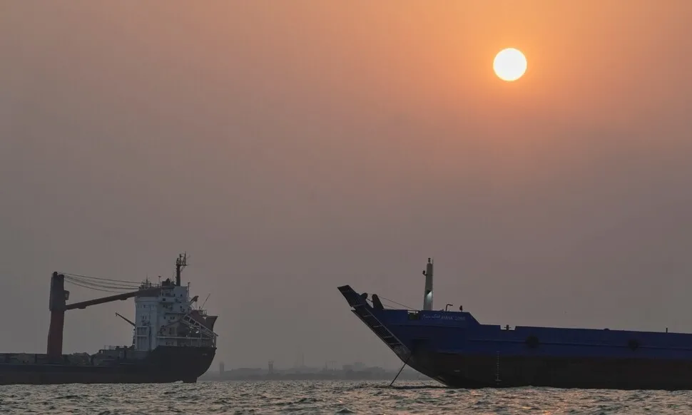 Merchant ships anchored near the Strait of Hormuz off Bandar Abbas, Iran