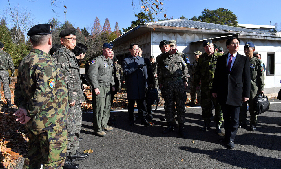 South Korean Defense Minister Song Young-moo listens to Lt. Col Kwon Young-hwan