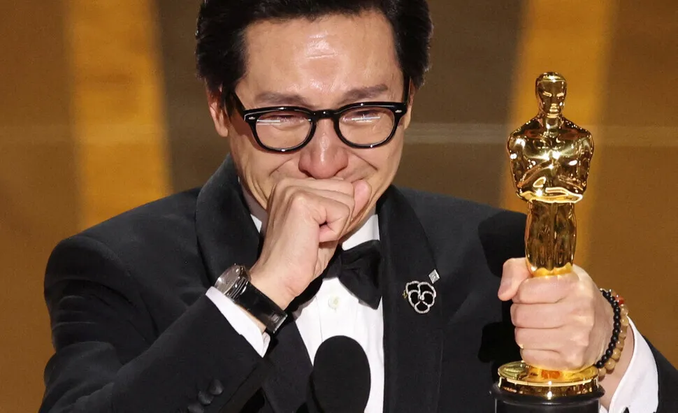 Ke Huy Quan holds back tears while accepting his Oscar for his supporting role in “Everything Everywhere All At Once” at the 95th Academy Awards, held at the Dolby Theater in Los Angeles, California, on March 12 (local time). (Reuters/Yonhap)