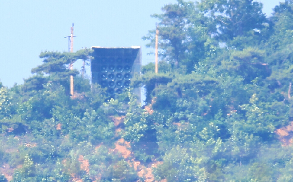 Military installations believed to be loudspeakers on a mountain in North Korea’s Kaepung County, near the inter-Korean border, as seen from the South. (Yonhap)