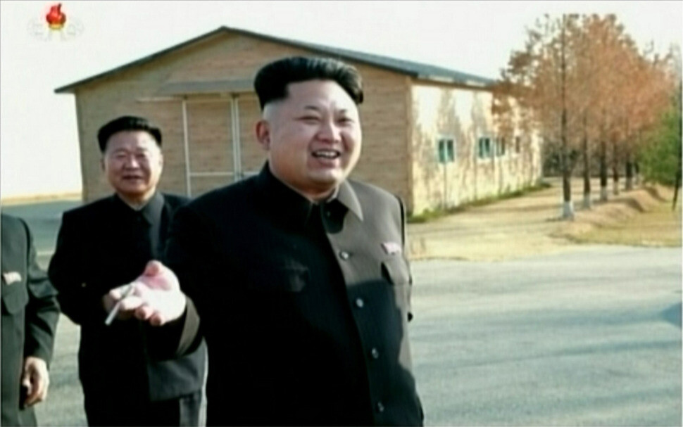 North Korean leader Kim Jong-un seen smoking a cigarette in Pyongyang in Nov. 2014. (Yonhap News)