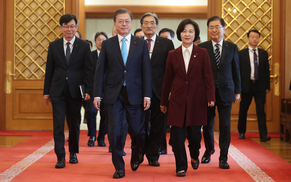 South Korean President Moon Jae-in heads to a meeting room with Choo Mi-ae after certifying her as the new justice minister at the Blue House on Jan. 2. (Blue House photo pool)