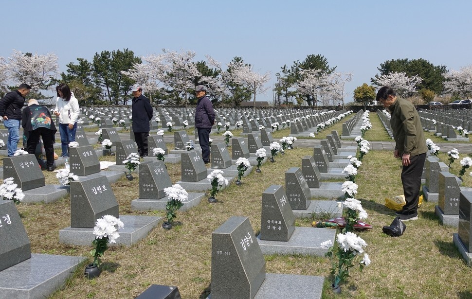 Surviving family members and descendants of Jeju Massacre victims visit tombstones erected for victims who went missing at Jeju 4.3 Peace Park on Apr. 2.