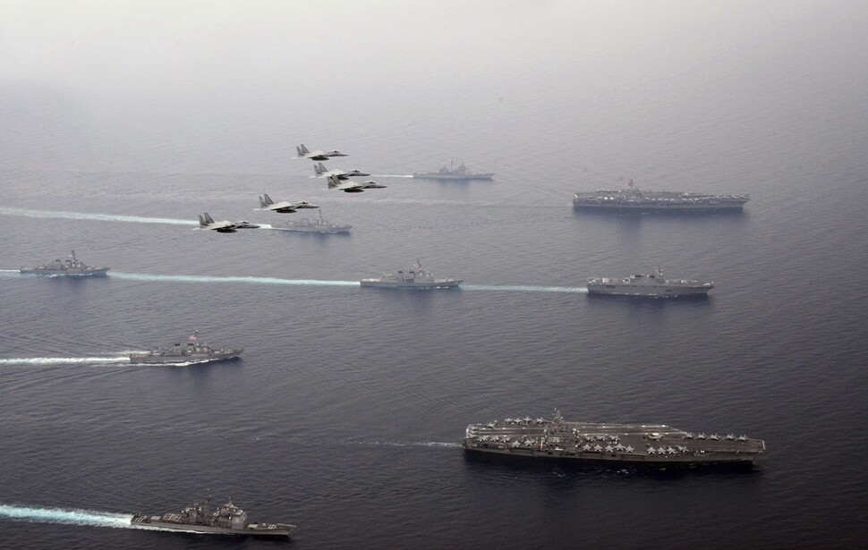 The USS Carl Vinson (top right) and the USS Ronald Reagan (lower right) aircraft carriers during exercises with the Japan Self-Defense Forces in the East Sea