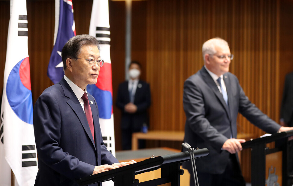 While on a state visit to Australia, South Korean President Moon Jae-in responds to reporters’ questions at a joint press conference with Australian Prime Minister Scott Morrison at the Australian Parliament House in Canberra on Monday. (Yonhap News)