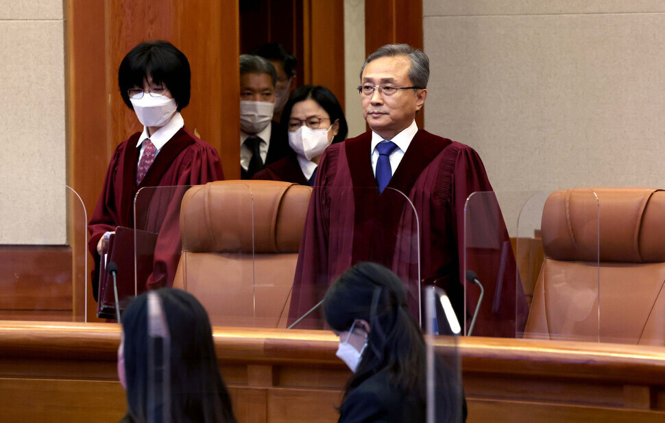Justices of the Constitutional Court file into the Grand Courtroom in the courthouse in Seoul’s Jongno District on March 23. (Yonhap)