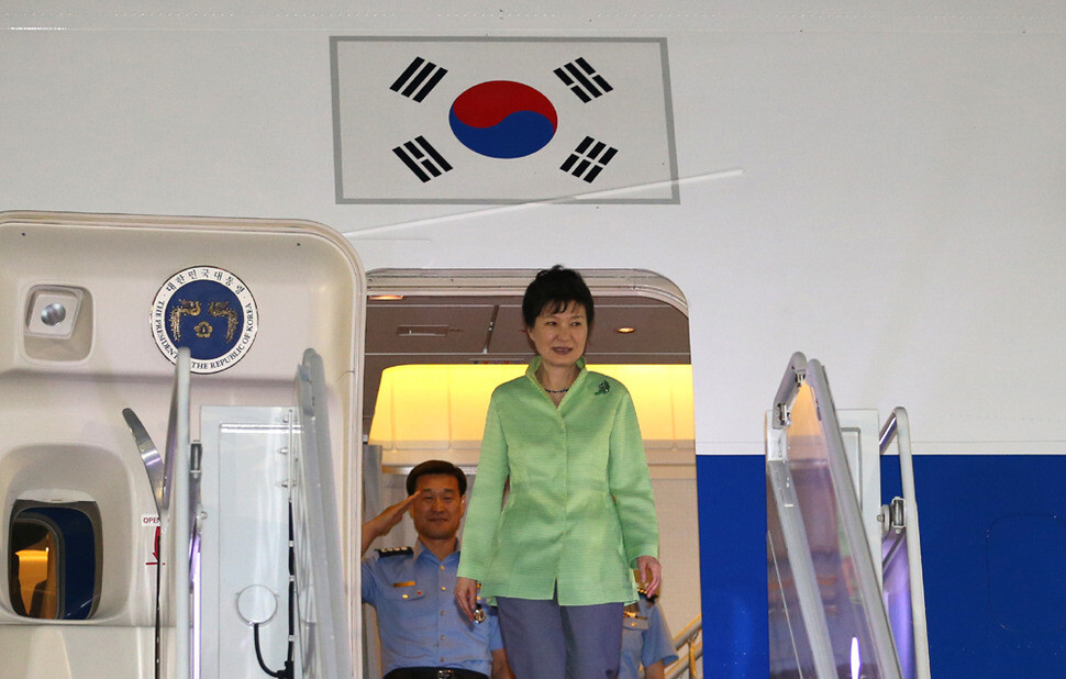 President Park Geun-hye disembarks from her plane at Seoul Air Base in Seongnam
