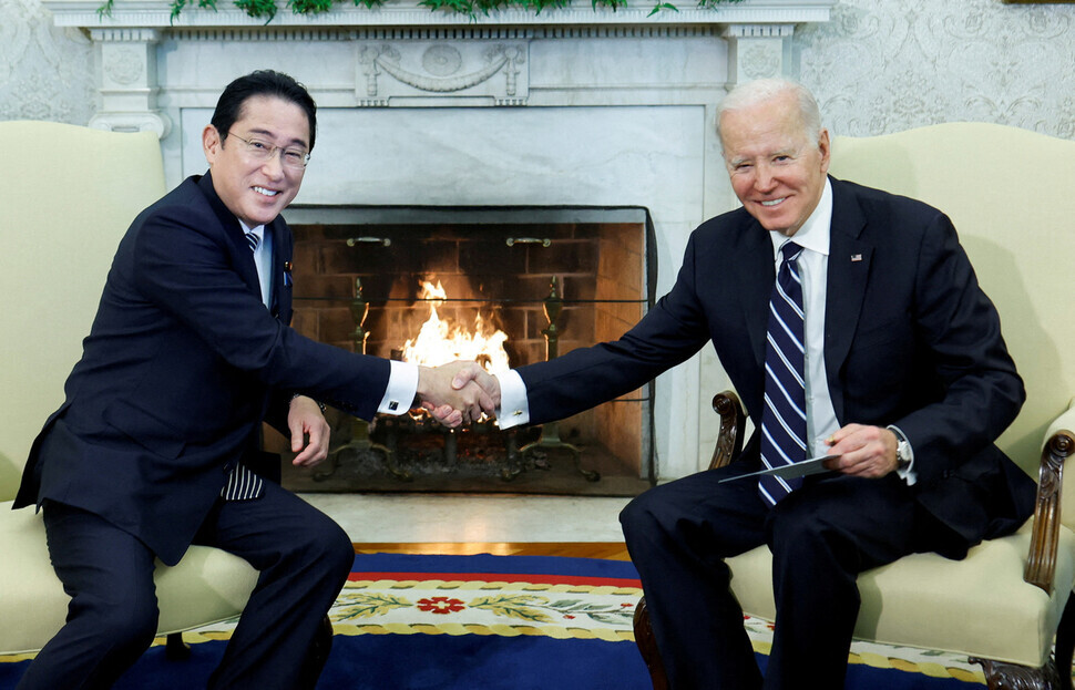 Prime Minister Fumio Kishida of Japan and President Joe Biden of the US shake hands as they kick off a bilateral summit at the White House on Jan. 13. (Reuters/Yonhap)