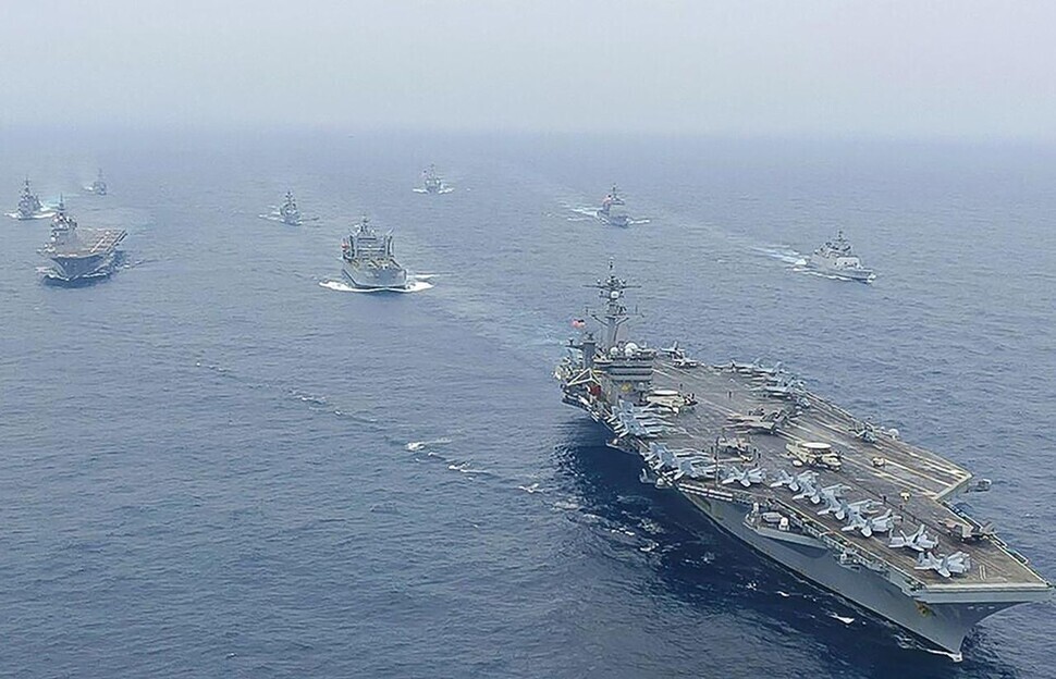The Quad — a security dialogue among the US, India, Japan, and Australia aimed at containing China — conducts Malabar joint naval exercises in the Indian Ocean in October 2020. (AFP/Yonhap)