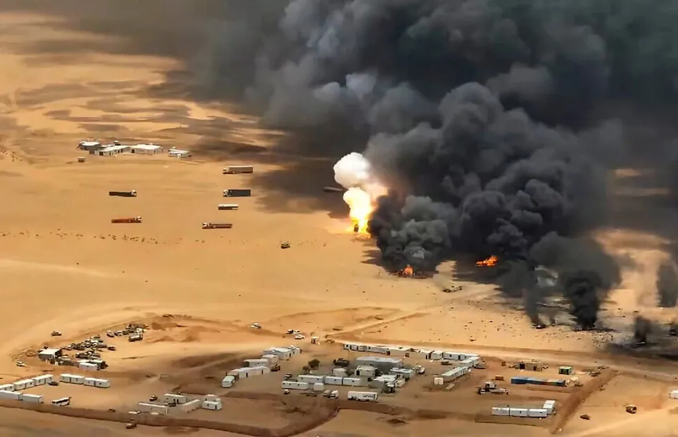 Smoke rises from trucks at a camp of the Saudi-backed government forces following an alleged Houthi missile strike in the eastern province of Hadramout, Yemen. (UPI/Yonhap)