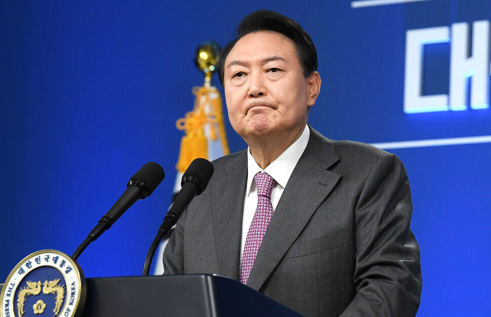 President Yoon Suk-yeol listens to a question from a member of the press during a news conference held at the presidential office in Yongsan to mark his 100th day in office on Aug. 17. (presidential office pool photo)