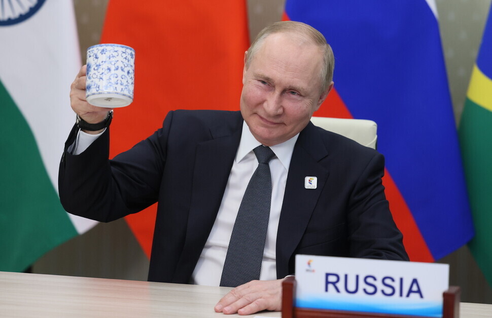 Russian President Vladimir Putin takes part in a BRICS economic forum on June 24. (EPA/Yonhap News)