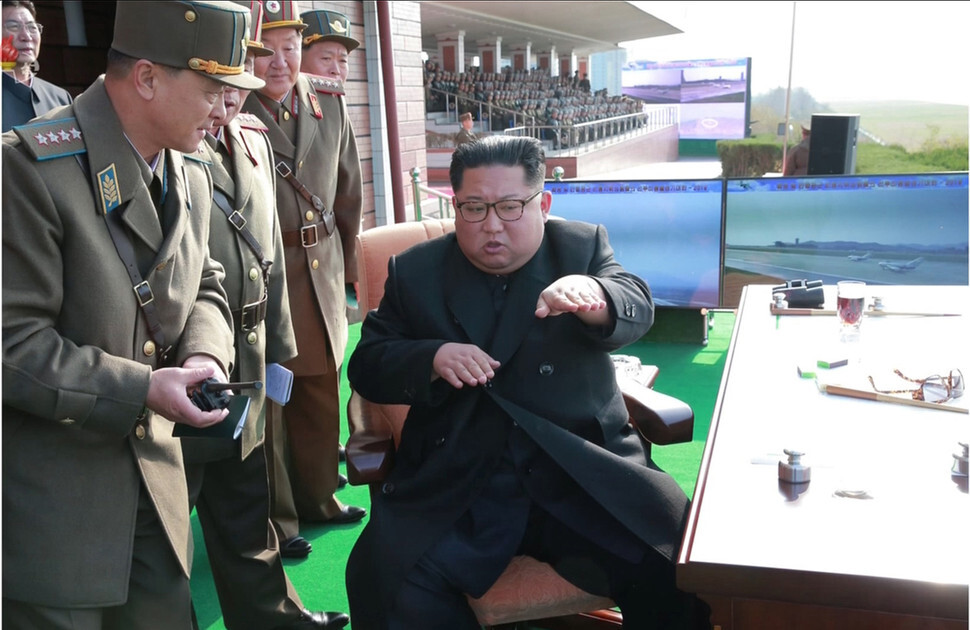 An image of North Korean leader Kim Jong-un overseeing a massive gathering of the North Korean Air Force at Wonsan-Kalma International Airport published by the Rodong Sinmun on Nov. 16. (Yonhap News)