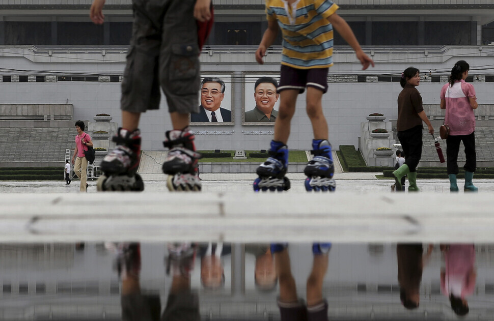 Children skate through Kim Il-sung Square in Pyongyang in July 2013. (AP/Yonhap)