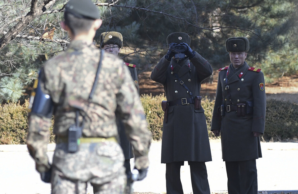 North Korean soldiers observe the situation at the JSA on Nov. 27. (Photo Pool)