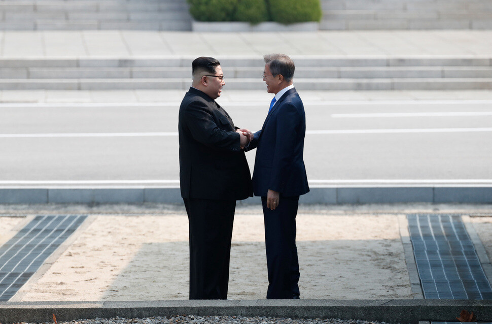 South Korean President Moon Jae-in shakes hands with North Korean leader Kim Jong-un upon meeting for the first time at the Panmunjeom Joint Security Area on Apr. 27. (by Kim Kyung-ho