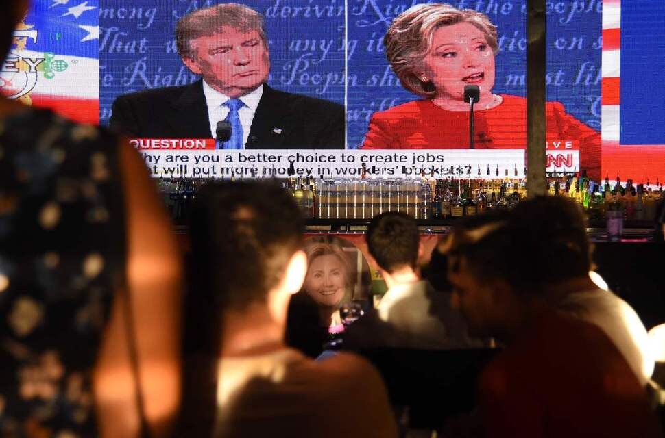 Hillary Clinton supporters watch the first televised debate between her and Donald Trump at The Abbey Food and Bar in West Hollywood