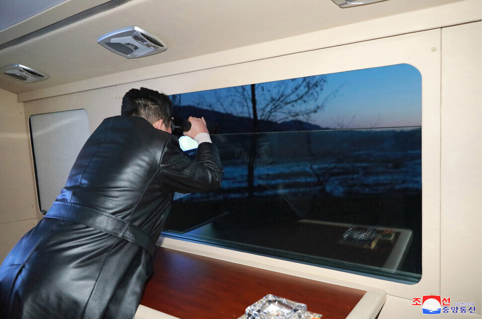 Kim Jong-un watches Tuesday’s missile test from a private train. (KCNA/Yonhap News)