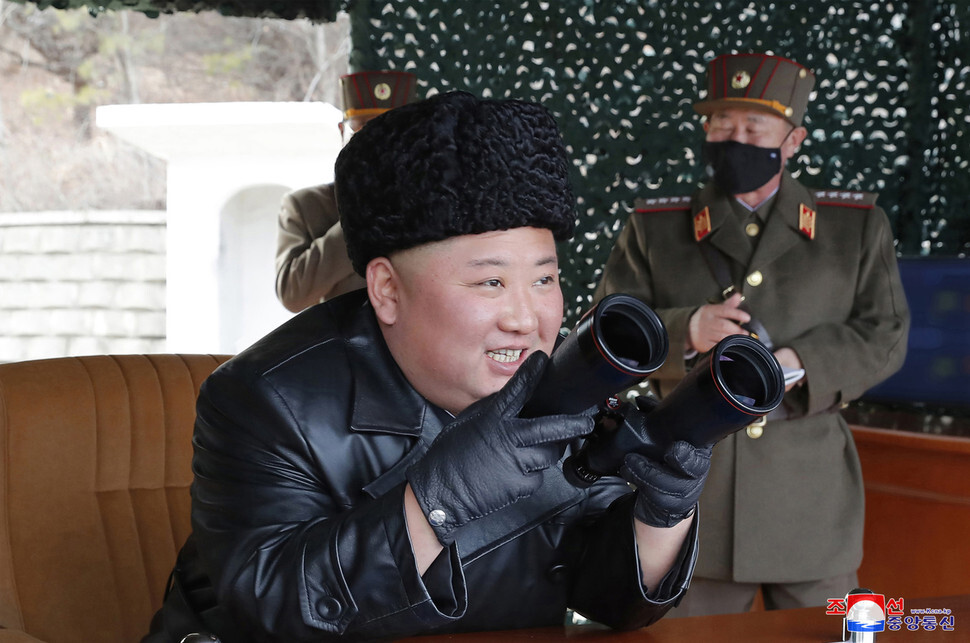 North Korean leader Kim Jong-un oversees the test launch of projectiles from the area of Wonsan on Mar. 2. (KCNA/Yonhap News)