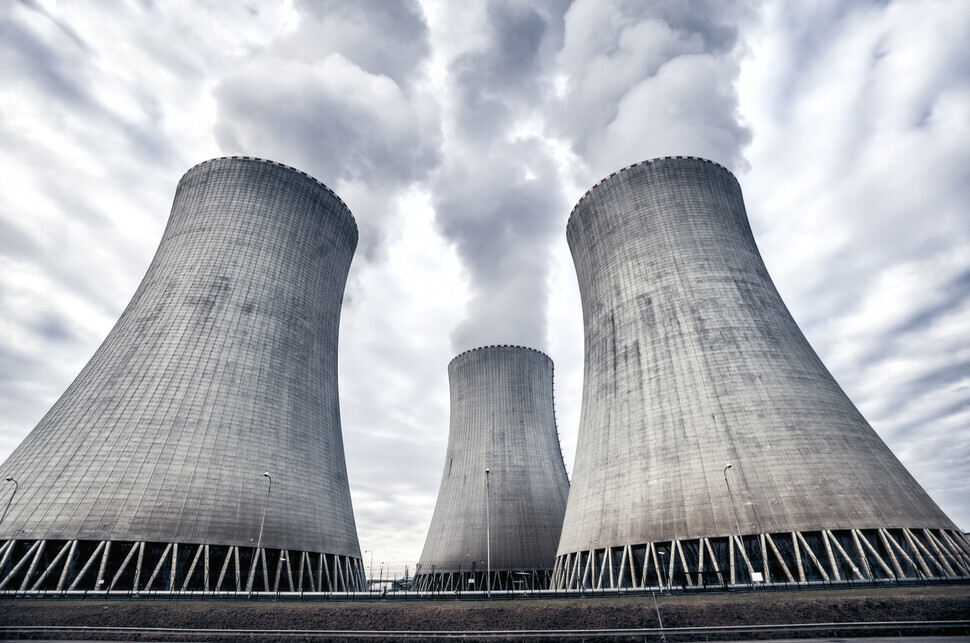 The cooling tower of a nuclear power station expels white smoke. (Getty Images)