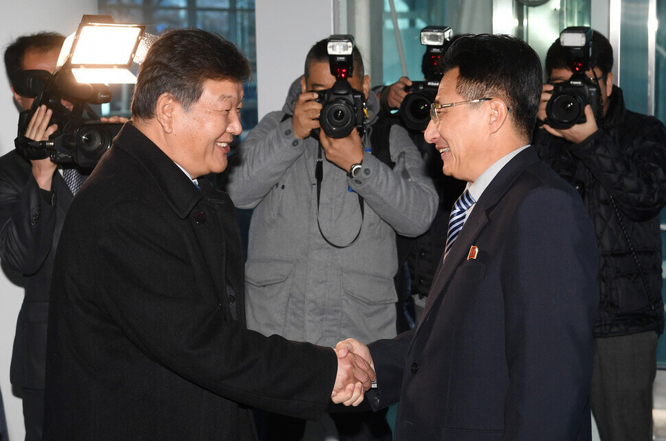 Roh Tae-kang, then-vice culture minister, shakes hands with North Korean vice sports minister Won Gil-woo in Kaesong before their meeting on Dec. 14, 2018. (pool photo)