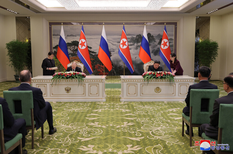 Russian President Vladimir Putin (left) and North Korean leader Kim Jong-un sign their “DPRK-Russia Treaty on Comprehensive Strategic Partnership” on June 19, 2024, in this photo released June 20 by KCNA. (KCNA/Yonhap)