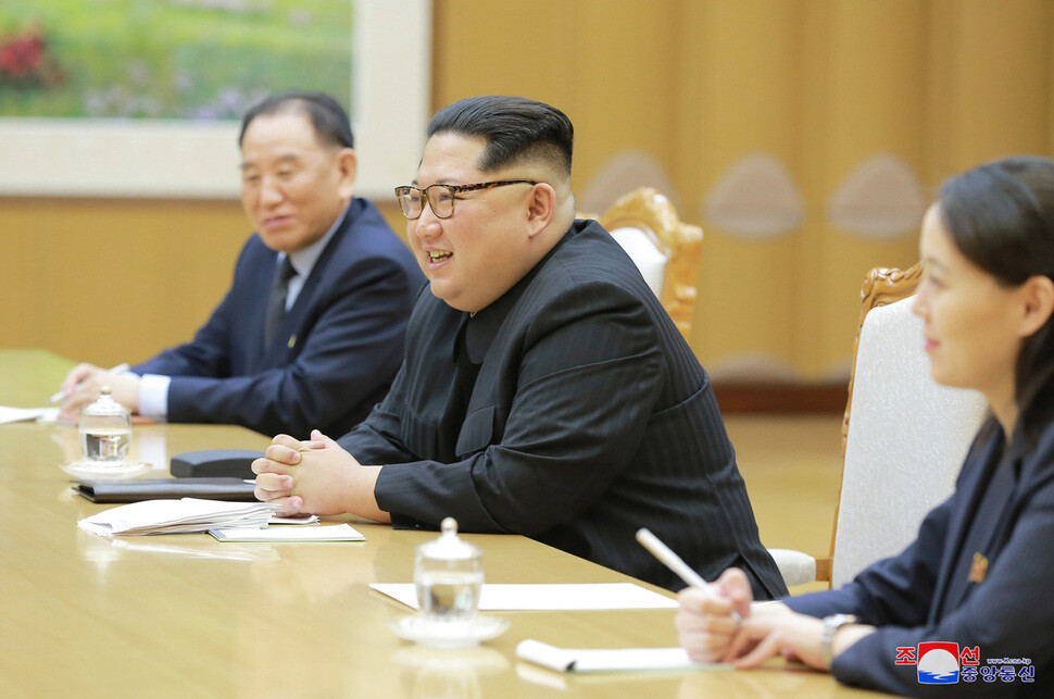North Korean leader Kim Jong-un speaks during a meeting with South Korean special envoy Chung Eui-yong in Pyongyang on Mar. 5. Kim is flanked by Kim Yong-chol