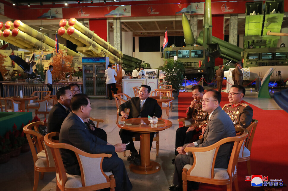 North Korean leader Kim Jong-un sits with high-level officials including Chief of the Academy of the National Defence Science Jang Chang-ha (seated to the right of Kim Jong-un) and member of the Presidium of the WPK Politburo Jo Yong-won (front row, right). (KCNA/Yonhap News)