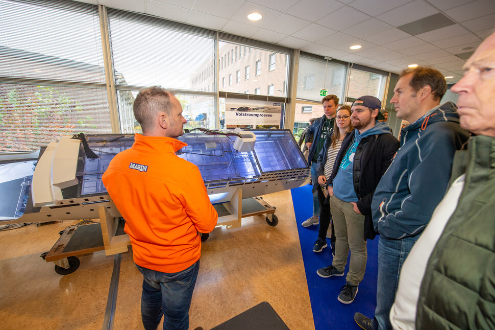 MARIN researcher Rinnert van Basten Batenburg talks about Model 9930 of MV Sewol to the visitors at the open house event held at the MARIN headquarters in Wageningen, the Netherlands, on Nov. 10, 2018. (Provided by MARIN)