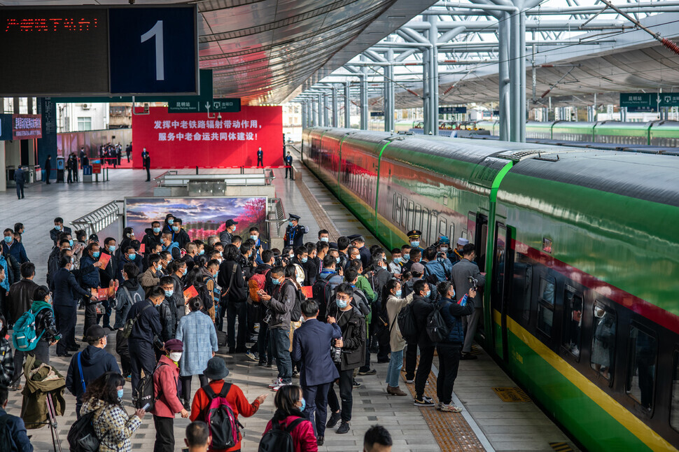 Travelers wait to board a train running along the China-Laos railway at a station in Kunming, Yunnan, on Dec. 3. (Xinhua News Agency)