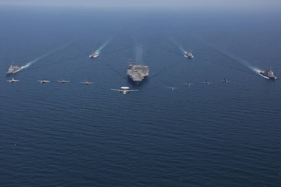 The USS Abraham Lincoln aircraft carrier navigates the East Sea with vessels from the US and Japanese Maritime Self-Defense Force on April 13. (provided by the US 7th Fleet)