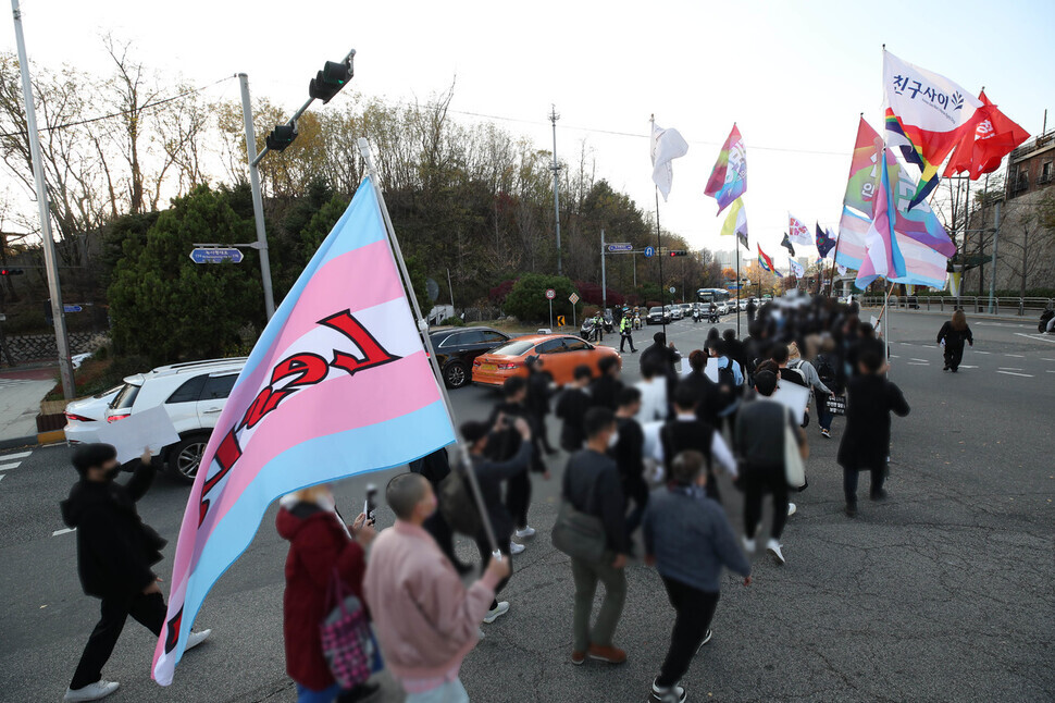 Following a Transgender Day of Remembrance rally in Itaewon, Seoul, on Nov. 20, participants march toward the presidential office.