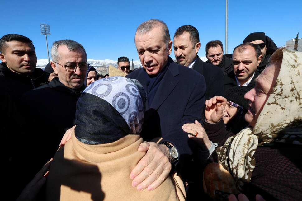 President Recep Tayyip Erdogan of Türkiye meets with earthquake survivors in Kahramanmaras on Feb. 8. While speaking to reporters on the ground, the president acknowledged shortcomings in the response but said, “It is not possible to be prepared for such a disaster.” (AP/Yonhap)