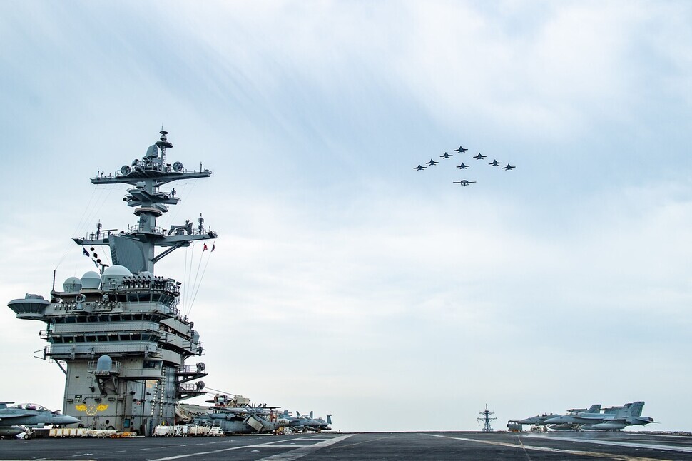Aircraft fly in formation over the Nimitz-class aircraft carrier USS Theodore Roosevelt (CVN 71) during a trilateral exercise on April 11, 2024. (courtesy of US 7th Fleet)
