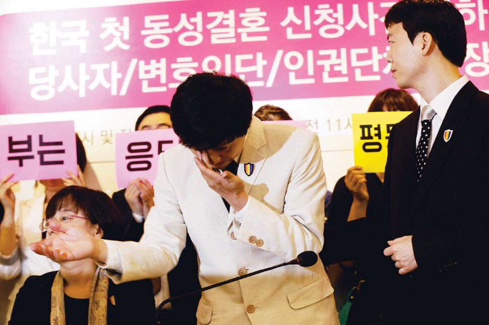 Kim-Jho Kwang-soo wipes away a tear during a press conference at People’s Solidarity for Participatory Democracy’s Zelkova Tree Hall in Seoul’s Jongno district