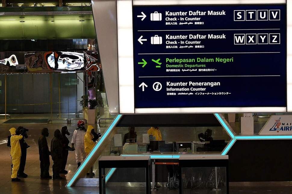 Workers disinfect Kuala Lumpur International Airport of any traces of nerve gas
