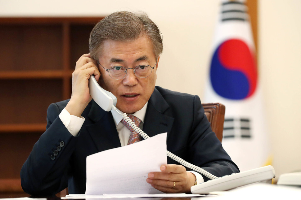 South Korean President Moon Jae-in takes a congratulatory phone call from Chinese President Xi Jinping