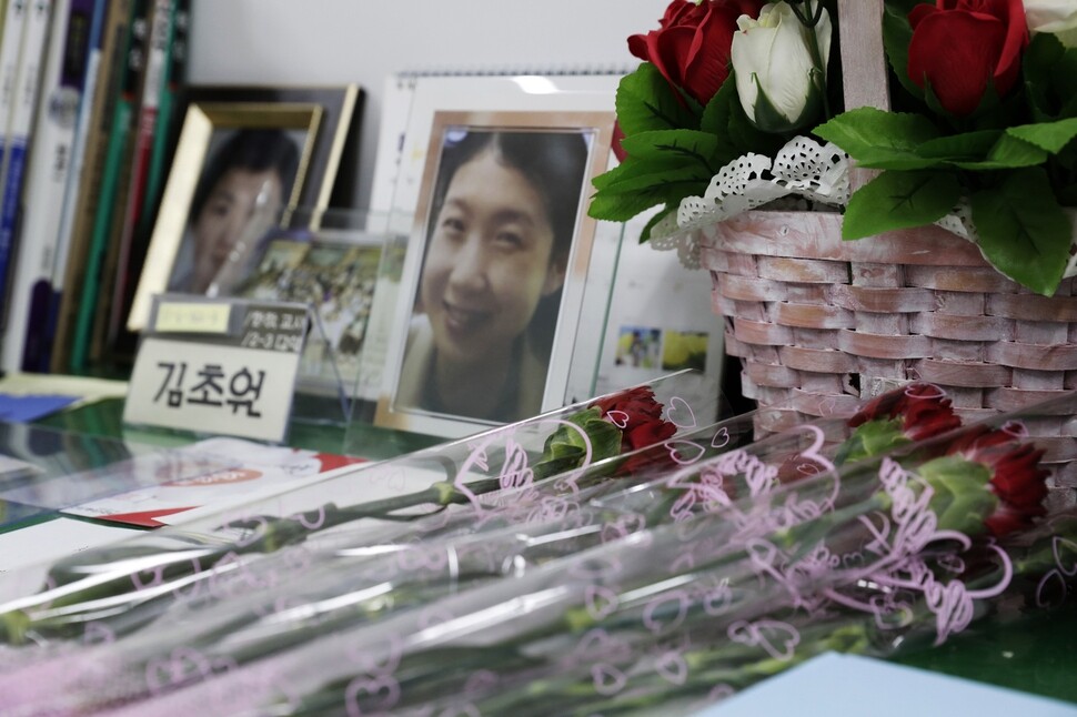  cries while receiving a carnation at the government memorial to the Sewol
