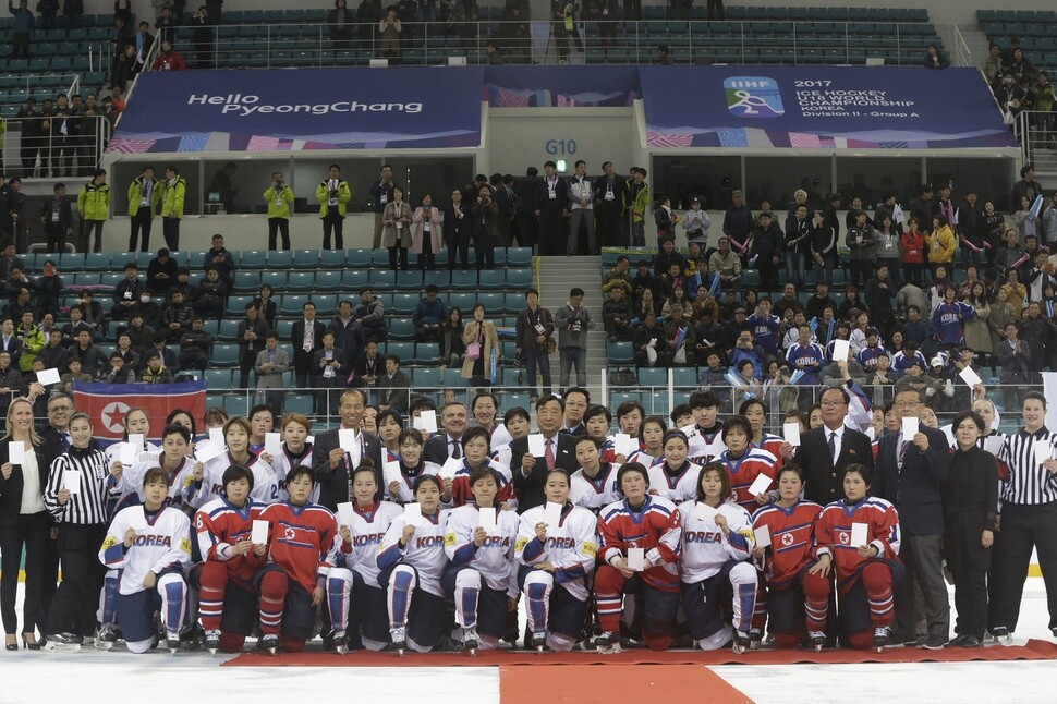 Members of the North and South Korean women’s ice hockey teams pose for a photo along with representatives from the International Ice Hockey Federation at the 2017 Women’s Ice Hockey World Championships in Gangneung