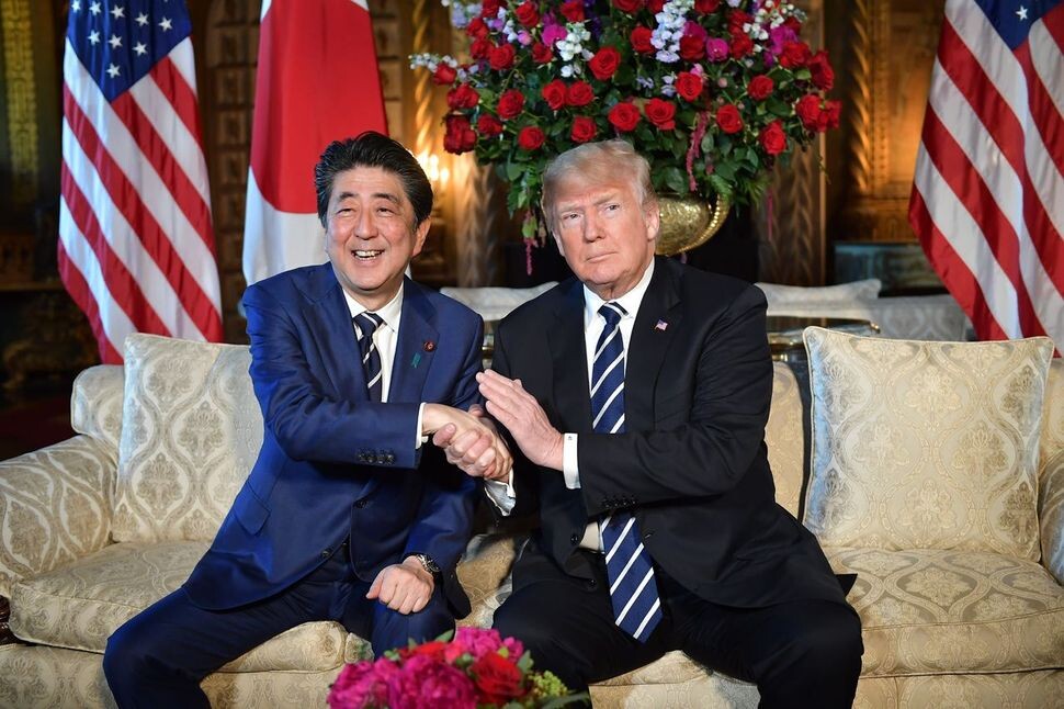 Japanese Prime Minister Shinzo Abe (left) shakes hands with US President Donald Trump when the two leaders met in Trump’s private Mar-a-Lago estate in Florida in April. (AFP)