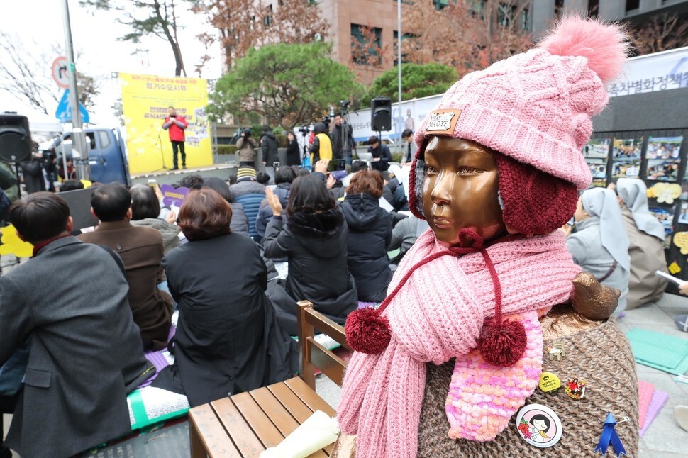 Civic demonstrators gather near the comfort women memorial in front of the Japanese embassy on Nov. 21
