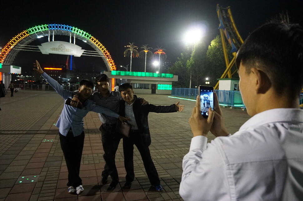 Young North Koreans pose for a photo in Kaeson Youth Park on May 7.