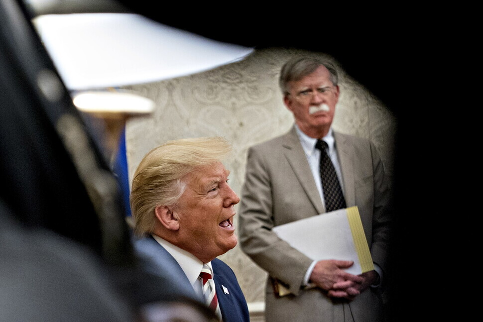 US President Donald Trump and former National Security Advisor John Bolton at the White House on Aug. 20, 2019. (Yonhap News)