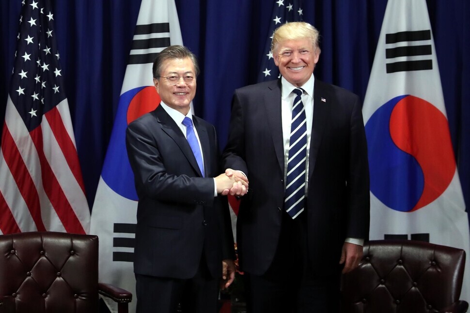 South Korean President Moon Jae-in and US President Donald Trump shake hands at the Lotte New York Palace during their summit in September 2019. (Blue House photo pool)