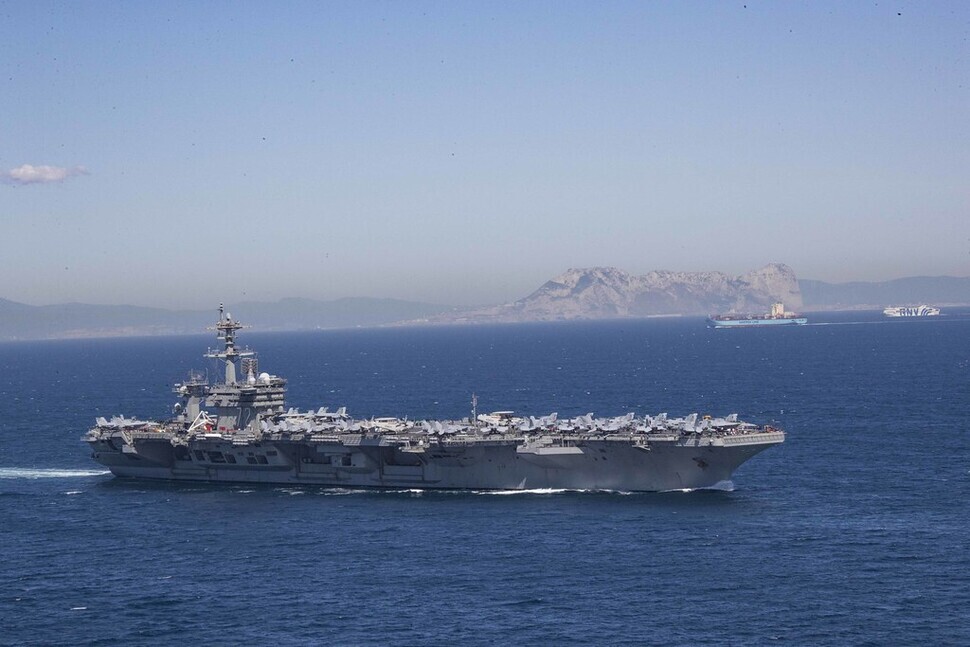 The USS Abraham Lincoln aircraft carrier passes through the Strait of Gibraltar on April 13, 2019. (from the US Navy website)