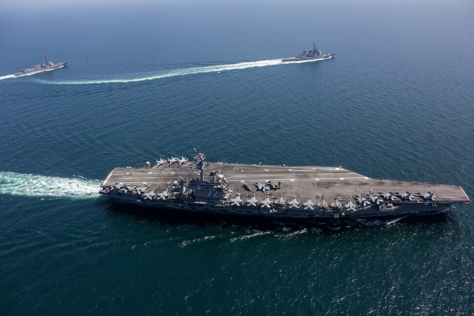 The USS Abraham Lincoln aircraft carrier navigates the East Sea with vessels from the US and Japanese Maritime Self-Defense Force on April 13. (provided by the US 7th Fleet)