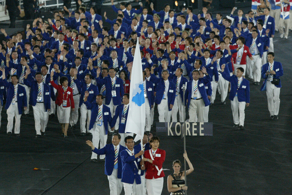 The unified Korean team makes a joint entrance to the opening ceremony of the Athens Summer Olympics in 2004. (Olympics Photo Pool)