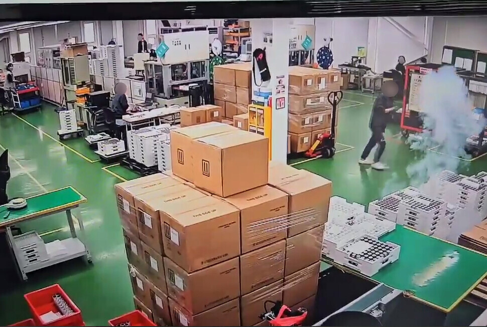 Still from CCTV footage from inside the Aricell lithium battery factory in Hwaseong, Gyeonggi Province, on June 24, 2024, at the moment that workers realize that batteries have begun exploding.